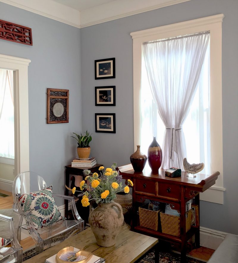 Miixed use of antique & modern. eastern & western style furniture • Louis Ghost Chairs provide extra seating without crowding the small space